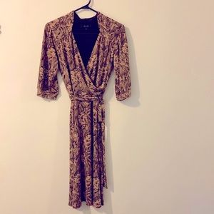 Formfitting and structured, classic midi dress